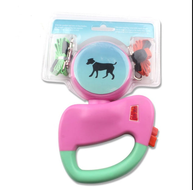 Pink and green dog leash with a blue and pink handle on a white background