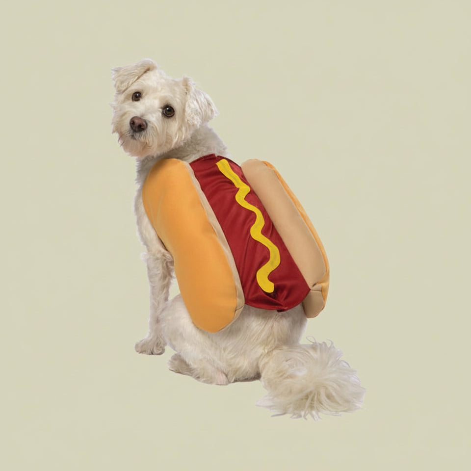 Side view of a dog wearing a detailed hot dog pet costume with mustard print
