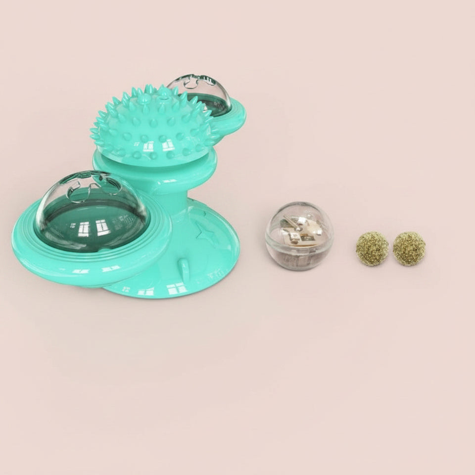 "Close-up of secure suction cup base mounted to a glass window with cat spinning the toy."